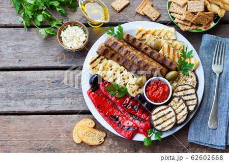 Traditional middle eastern, arabic or mediterranean meat kebab with grilled vegetables. Copy space. Top view. 62602668