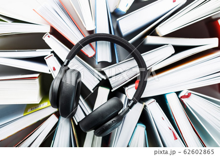 Wireless overhead black headphones lie on the 62602865