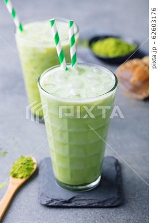 Matcha iced green tea. Grey background. Close up. Matcha iced green tea. Grey background. Close up. 62603176