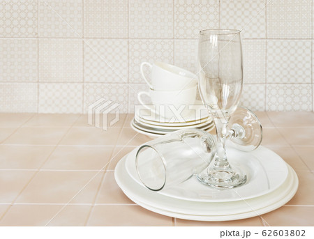 Clean dishes on the kitchen table 62603802