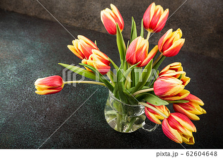 Red yellow tulips in glass vases Red yellow tulips in glass vases 62604648
