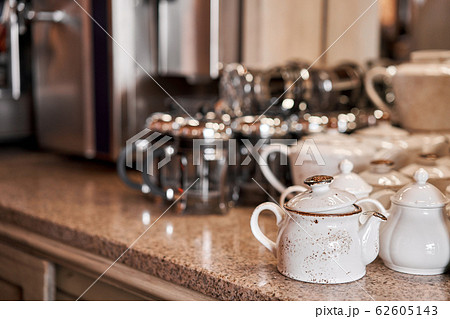 Group of empty cups and teapots in many rows. Tableware for coffee and tea in breakfast and seminar event. 62605143