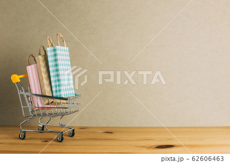 Paper shopping bags in Shopping cart. with copyspace 62606463