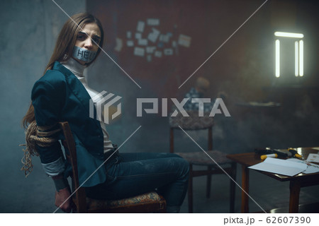Female victim with taped mouth, maniac kidnapper 62607390