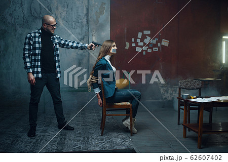 Maniac kidnapper puts a gun to his victim's head Maniac kidnapper puts a gun to his victim's head 62607402