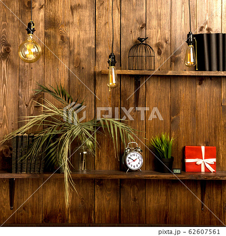 Stylish wooden wall with shelves in mahogany loft 62607561