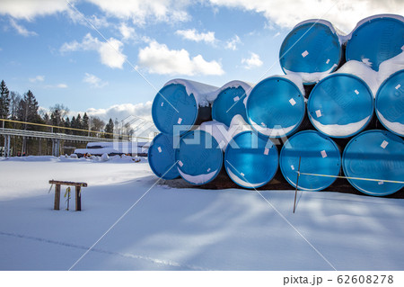 Pipes for the gas pipeline are in the snow 62608278