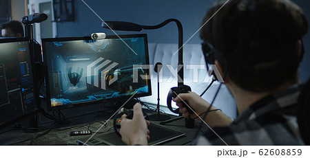 Developer playing a VR game or simulator Developer playing a VR game or simulator 62608859