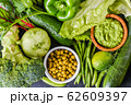 Flat lay assorted green toned vegetables, fresh organic raw food concept. 62609397