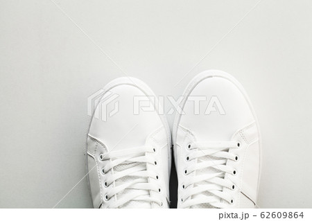 Stylish white fashion sneakers on white background. 62609864