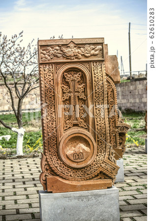 Stone cross carved with ornaments in the form of the first letter of the Armenian alphabet, created by Mesrop Mashtots in the village of Oshakan 62610283