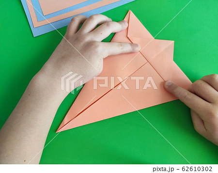 Origami step by step. How to make a paper bunny for Easter greetings Origami step by step. How to make a paper bunny for Easter greetings 62610302