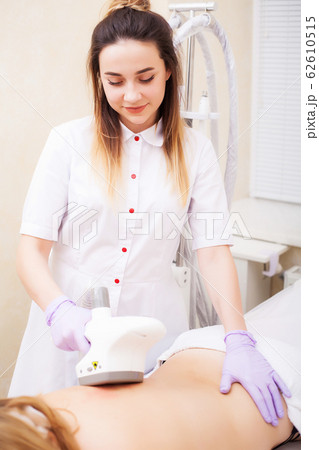 Body Care. Woman is in the process at the clinic lipomassage 62610515