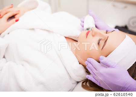 Woman getting LPG hardware massage at the beauty clinic. Professional beautician working 62610540