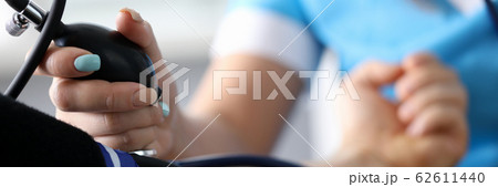 Woman applying tonometer 62611440