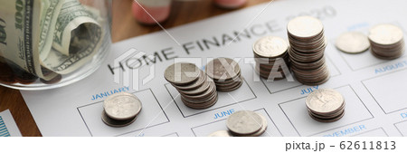 Top view of coin tover with paper calendar against 62611813
