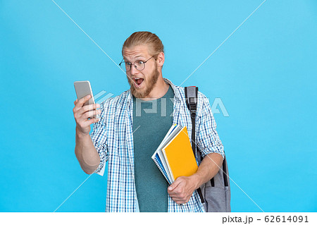 Bearded student glasses wow emotion hold modern smart phone read text message 62614091