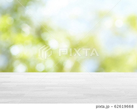 Empty wooden table on top with nature green back 62619668