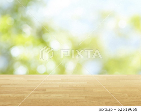 Wood table top on bokeh Green background 62619669