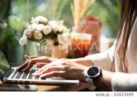 Closeup female hands typing on laptop keyboard. Closeup female hands typing on laptop keyboard. 62625699