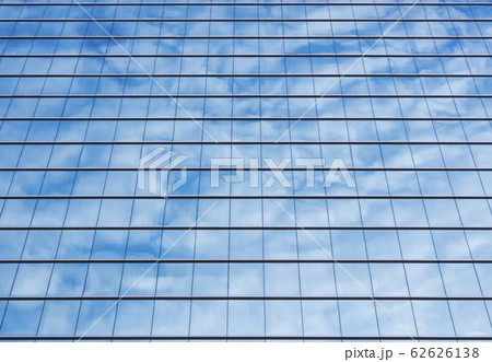 Architecture details Modern Building Glass facade reflection blue sky 62626138