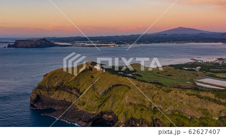 Aerial View of Udo Peak, Seongsan Ilchulbong Tuff Cone and Hallasan Mountain, Sunrise Time  62627407
