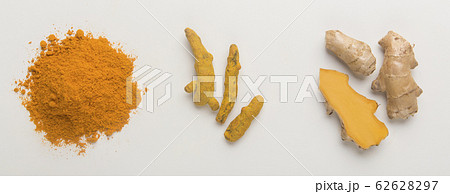 Turmeric extract powder and root on white background Turmeric extract powder and root on white background 62628297
