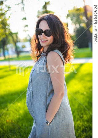 Pregnant woman outdoors 62635603