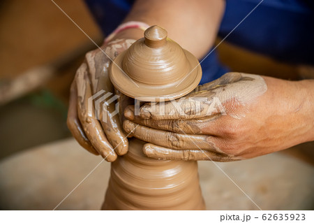 Potter at work makes ceramic dishes. India, Potter at work makes ceramic dishes. India, 62635923