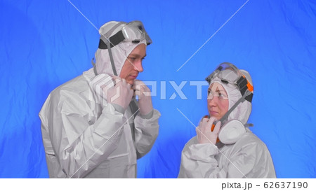 Doctor health worker in respirator. Slow motion. People portrait, wearing protect medical antibacterial antiviral aerosol spray paint mask. Doctor health worker in respirator. Slow motion. People portrait, wearing protect medical antibacterial antiviral aerosol spray paint mask. 62637190