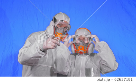 Doctor health worker in respirator. Slow motion. People portrait, wearing protect medical antibacterial antiviral aerosol spray paint mask. 62637191