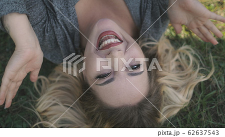 Happy Young Woman Close Eyes Game Lie Green Lawn Happy Young Woman Close Eyes Game Lie Green Lawn 62637543