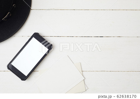 White office desk table with smartphone. 62638170
