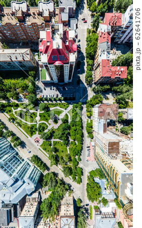 Aerial city view with roads, houses and buildings. Aerial city view with roads, houses and buildings. 62641706