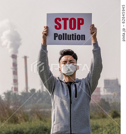 man hold stop pollution sign man hold stop pollution sign 62645945