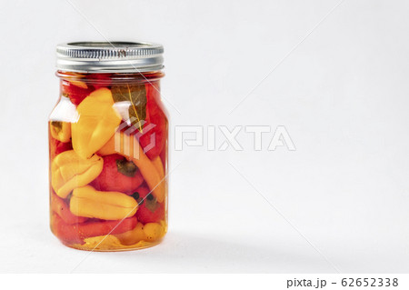 ar of pickled mix bell peppers and spices. 62652338