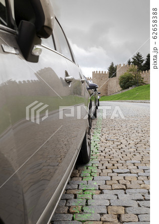 View reflected in a car from the walls of the 62658388