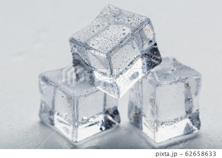Ice cubes in the form of a pyramid with water Ice cubes in the form of a pyramid with water 62658633
