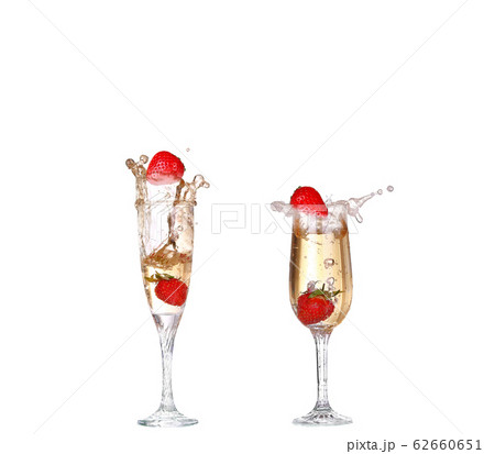 Single Strawberry splashing into a glass of Single Strawberry splashing into a glass of 62660651