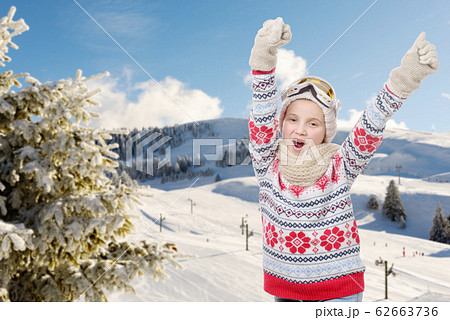 happy young girl snowboarding, skiing in 62663736