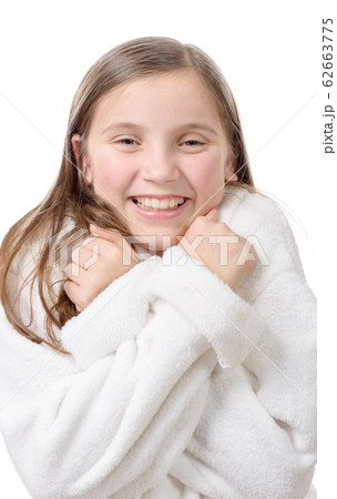 Young smiling girl with bathrobe, isolated on 62663775