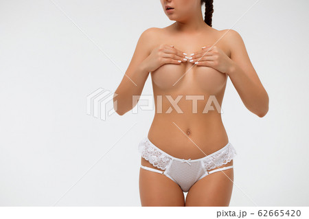 Crop sensual woman covering breast Crop sensual woman covering breast 62665420