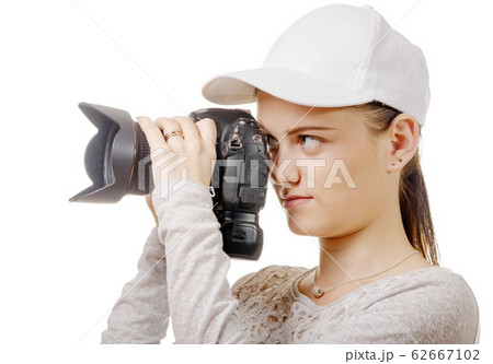 young photographer woman with white cap isolated young photographer woman with white cap isolated 62667102