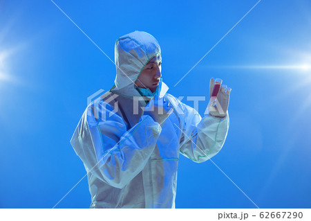 Medic in white hazmat protective suit, coronavirus illustration concept 62667290