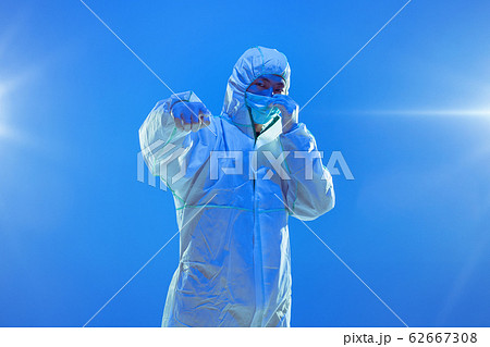 Medic in white hazmat protective suit, coronavirus illustration concept 62667308