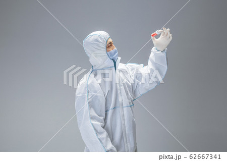 Medic in white hazmat protective suit, coronavirus illustration concept 62667341