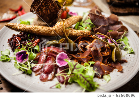 Meat platter for two served on a plate in restaurant 62668696