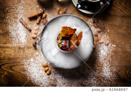 Chocolate mousse served with liquid ice smoke 62668697