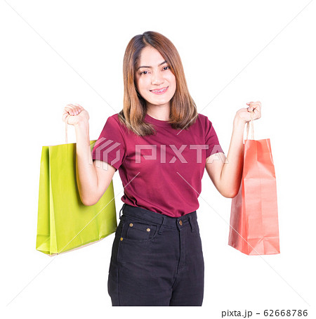 young woman pretty smiling holding paper bags young woman pretty smiling holding paper bags 62668786