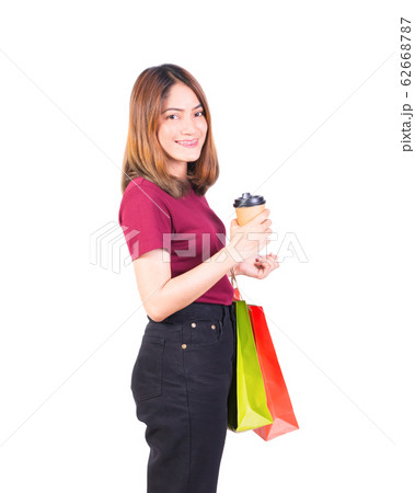 woman pretty smiling holding paper bags and Coffee woman pretty smiling holding paper bags and Coffee 62668787